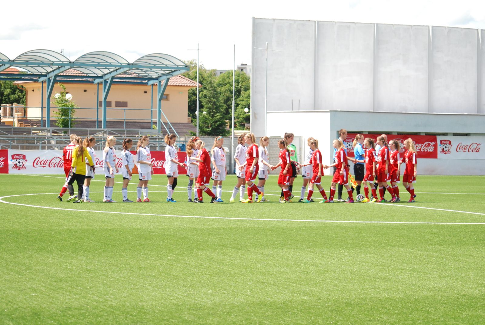Young sports teams meeting in a spirit of partnership and sportsmanship